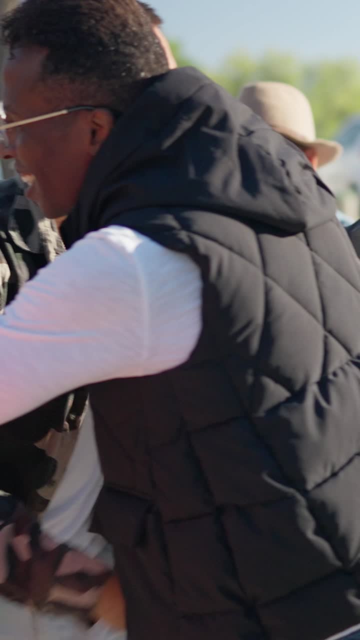 Friends Embracing and Having Fun Outdoors