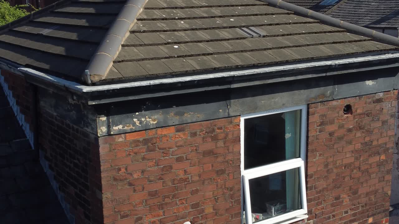 Rooftop inspection aerial view inspecting damage and repair of real estate for home improvement