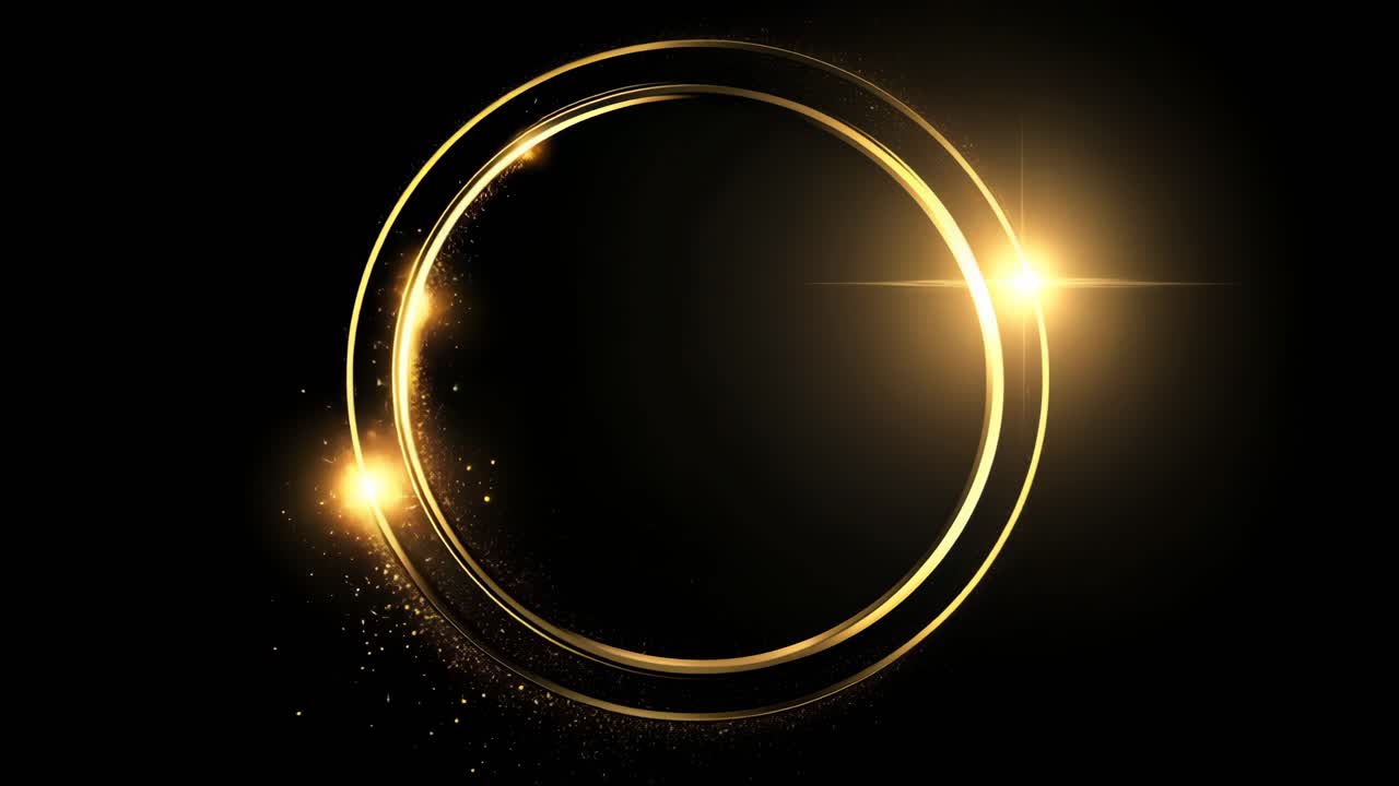 Aerial view of a glowing golden ring with sparkles on a black background, creating a dynamic