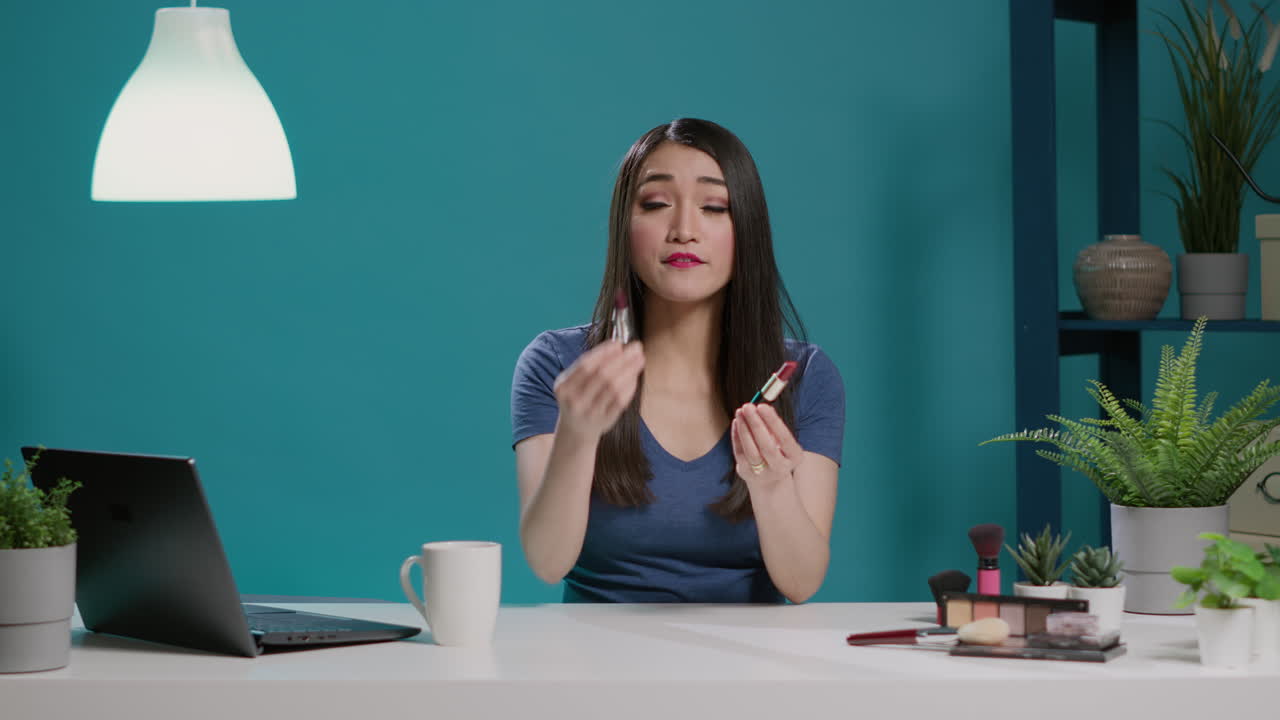 POV of content creator doing lipstick review on vlogging camera