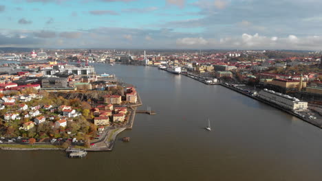 Amazing-aerial-view-of-river-Göta,-central-Gothenburg,-Sweden,-lowering,-sunset