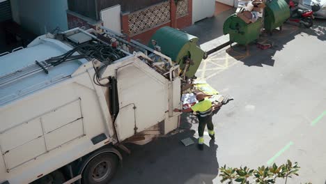 garbage truck collecting waste