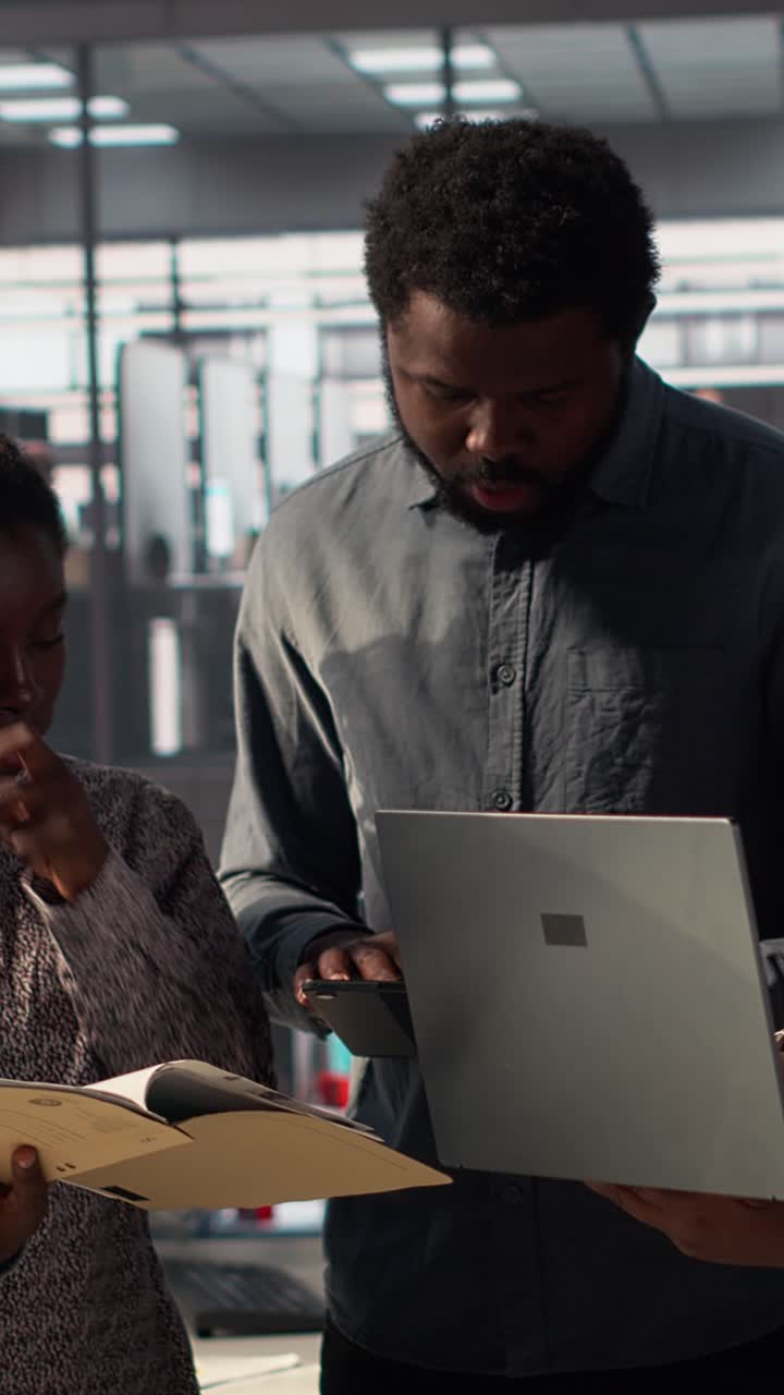 African Business Team Collaborating on Project in Modern Office