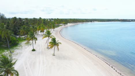 Flight-over-turquoise-waters-and-white-beach-of-Cap-Cana,-Dominican-Republic