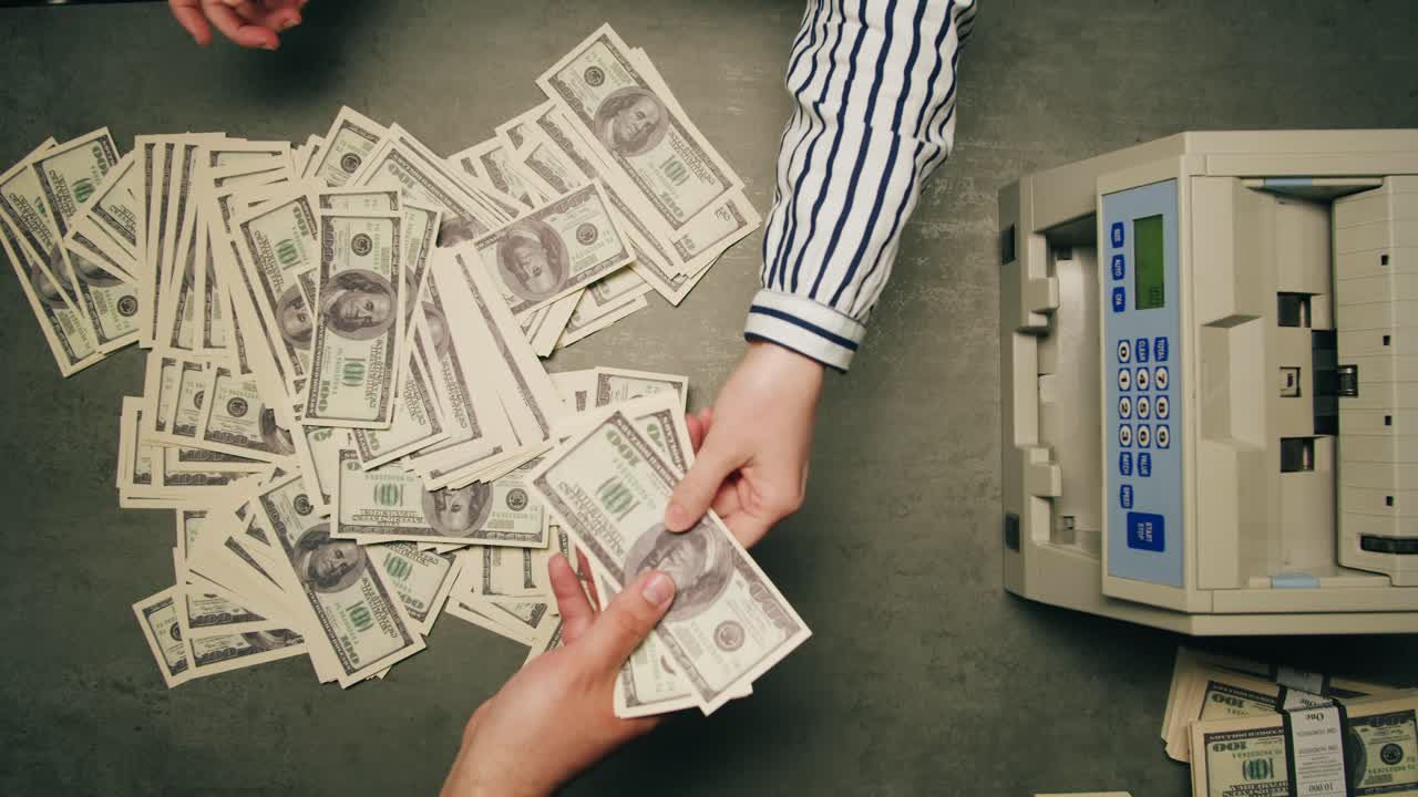 Specialised police officer Counting dollar banknotes in crime lab, conceptual image. High quality 4k footage