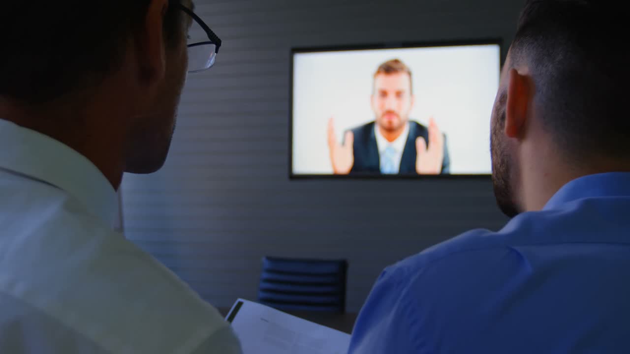 Executives talking during video conferencing 4k
