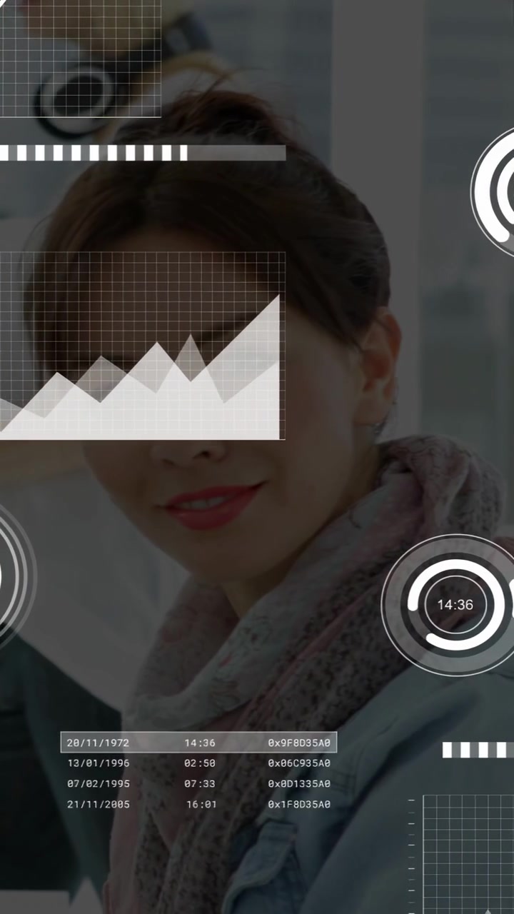 Vertical video: Woman watching screen while live data starting HUD charts, updating tech metrics
