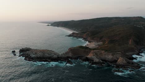 seascape view of cliffs and ocean in mazunte, mexico - aerial drone shot