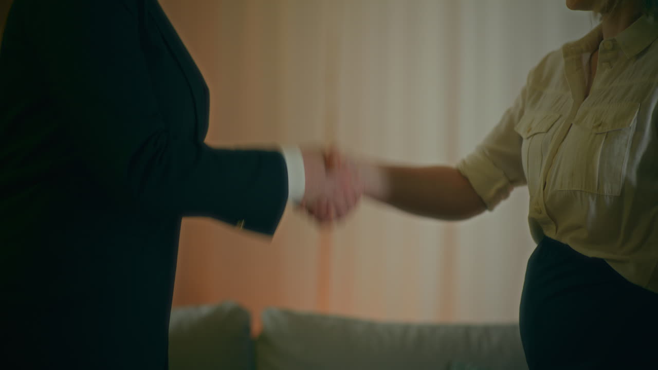 A Real Estate Agent Hands Over A Contract To A Client To Sign