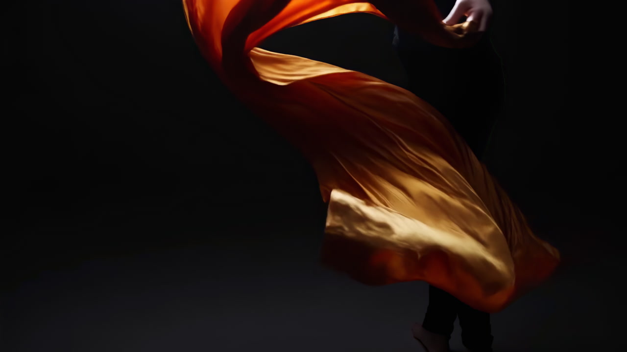 Dark Studio Dancer With Orange Silk Swirling, Dynamic Choreography And Dramatic Silhouette, Fluid Motion