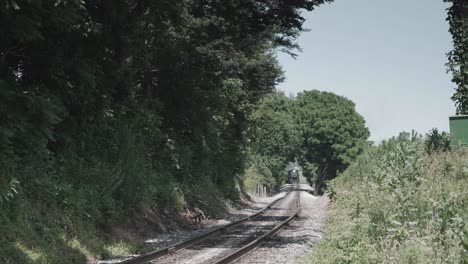 Vintage-Steam-Engine-Approaching-Head-on-with-a-full-Head-of-Steam