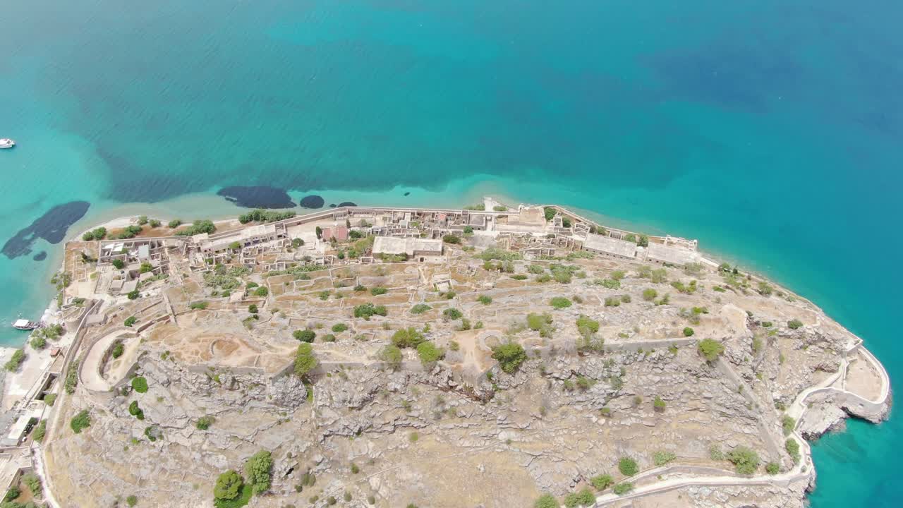Aerial flying over famous Spinalonga Island, a popular tour tourism destination in Crete
