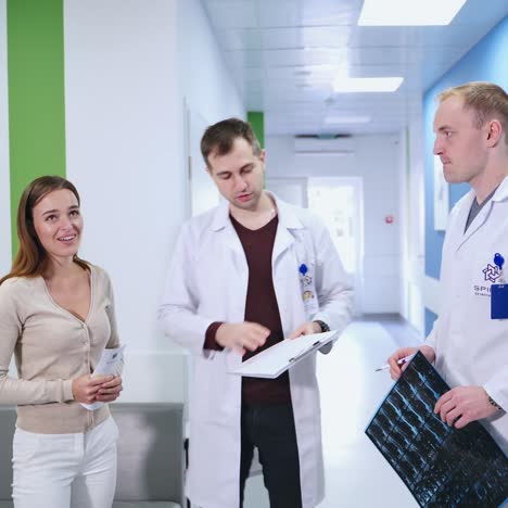 doctors talking with patient