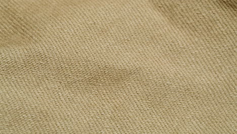 close-up view of a beige fabric texture