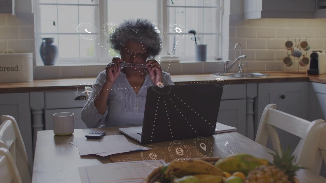 Senior African American Woman Using Augmented Reality Interface at Home