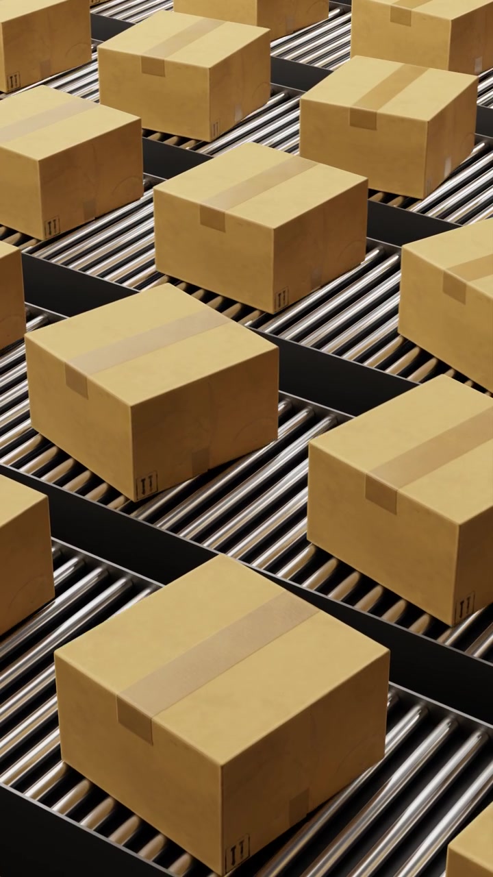 Cardboard boxes moving on warehouse conveyor belt line