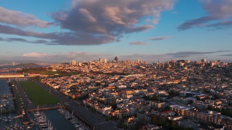 Drone-aerial-view-of-San-Francisco,-California-with-a-very-colorful-sunset