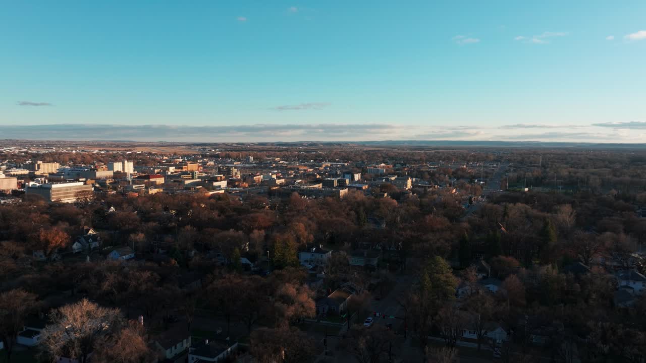 Drone shot pushing in on Bismarck, North Dakota at sunset