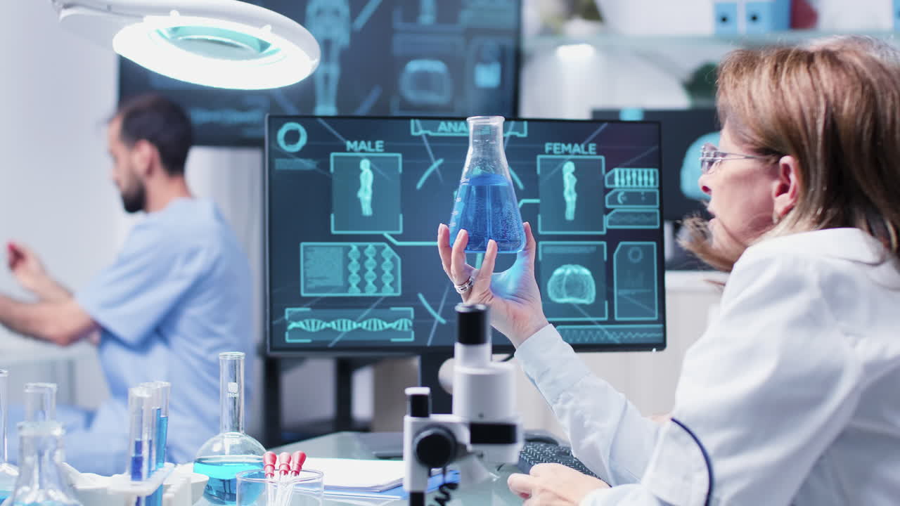 Scientists Analyzing Liquid Sample in Lab