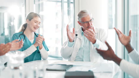 doctors applauding at a meeting