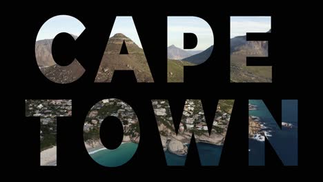 Drone-shot-of-coastline-With-Ocean-And-Countryside-In-South-Africa-Overlaid-With-Graphic-Spelling-Out-Cape-Town