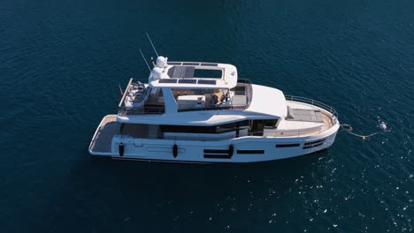 beautiful luxury yacht on calm sea in slow motion on a sunny day filmed by drone in slow motion