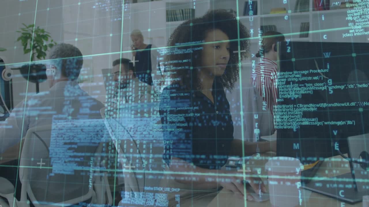 Software developer typing at tech office as code overlays cascading on monitor for programming task