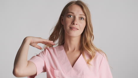 caucasian female doctor looking at the camera.