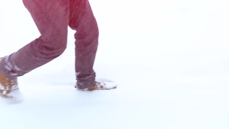 person walking in deep snow