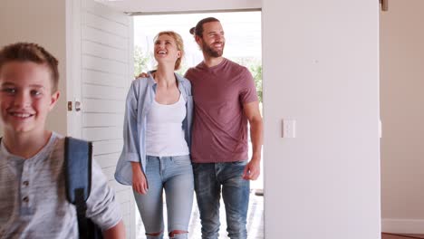 family opening door and walking in empty lounge of new home