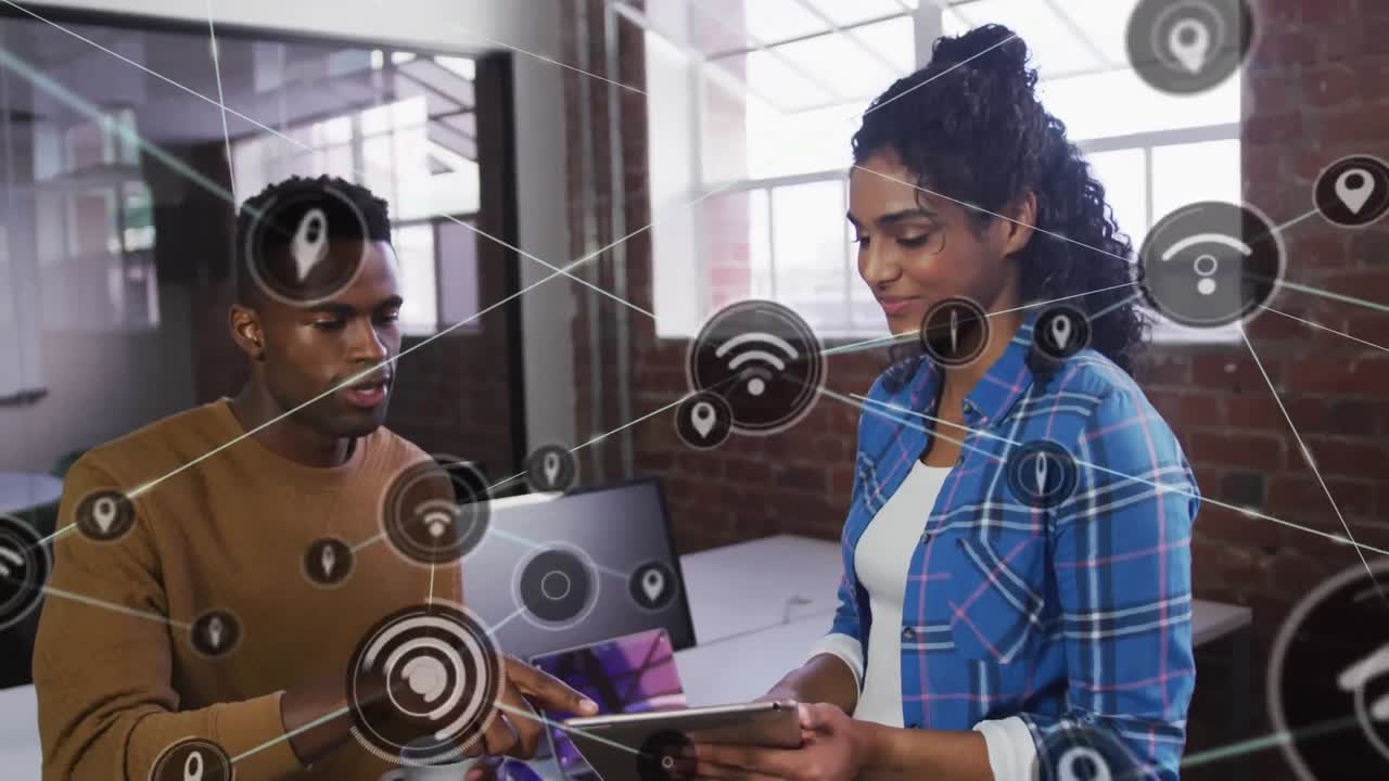 Animation of media icons over diverse business people talking