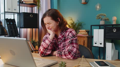 business woman freelancer girl working on laptop and feeling toothache touching mouth dental illness