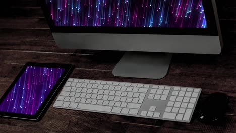 Animation-of-technological-devices-with-light-trails-on-screen-on-desk