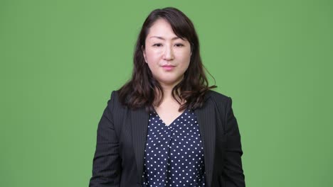 mature beautiful asian businesswoman covering mouth as three wise monkeys concept