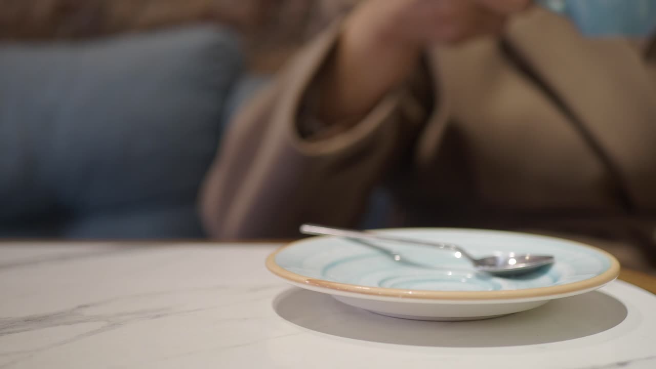 Coffee cup with spoon on table