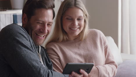 happy-couple-having-video-chat-using-smartphone-chatting-to-friend-smiling-excited-enjoying-online-communication-on-mobile-phone-at-home