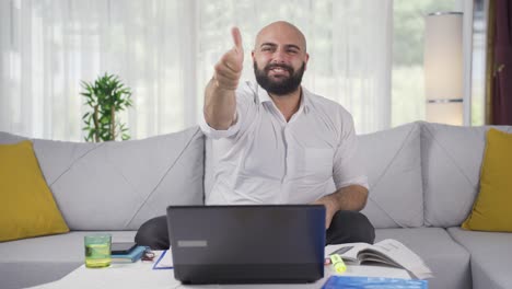 home office worker man looking at camera clapping and getting excited.