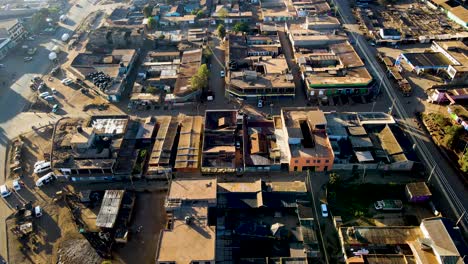 sunrise- kenya landscape with a village, kilimanjaro and amboseli national park - tracking, drone aerial view