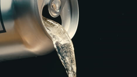 white wine, rose or off white liquid pouring out of silver can in super slow motion, black background of canned drink at 4k 800fps