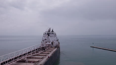 deck of mv sam laud bulk carrier dock in the harbour with seascape covered in fog