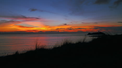 cinemagraph seamless video loop of a sunset evening seaside beach close to st ives in cornwall, england, uk