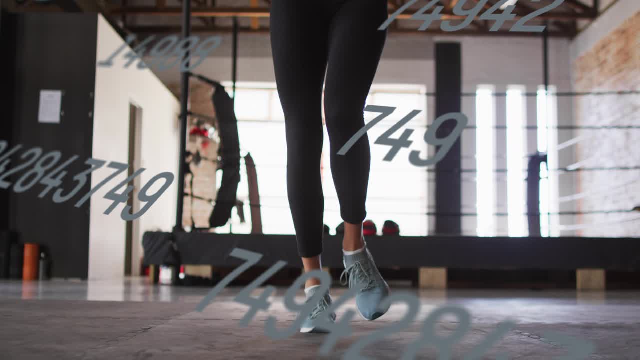 Woman starting two-foot hops then switching feet for cardio, numeric overlay obscuring shoes, feet