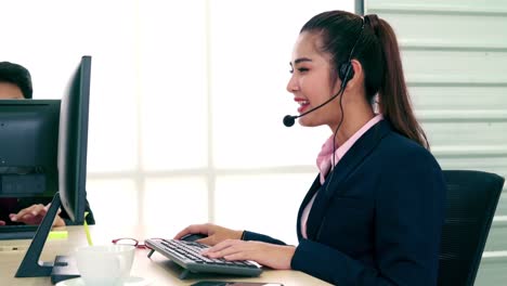 business people wearing headset working in office