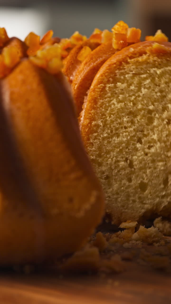 Knife cutting into Easter bundt cake revealing soft interior crumb, vertical