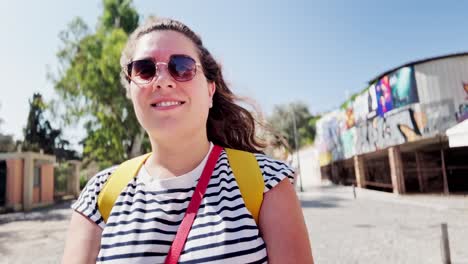 young female traveler taking a low-angle selfie in a city, athens, greece