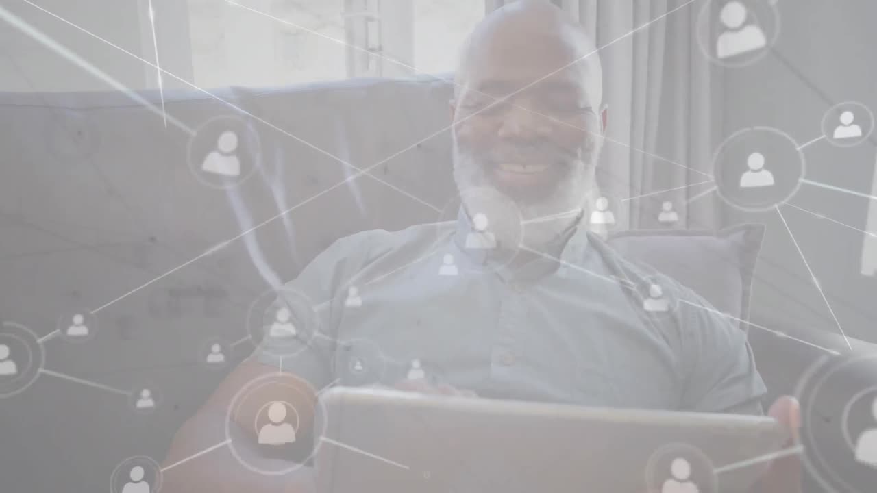 Animation of networks of connections with icons over man using tablet