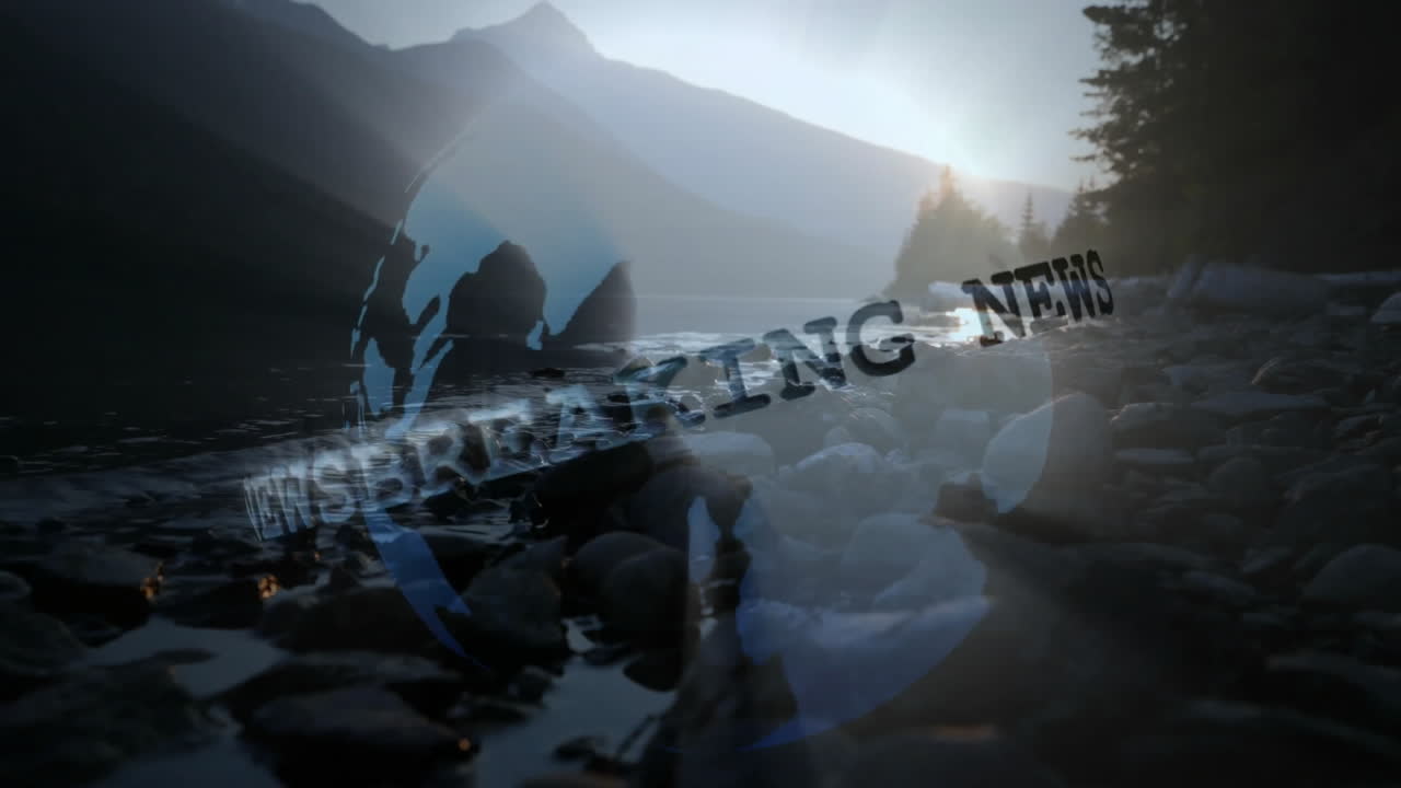 Alpine lake featuring rocky shore and peaks at dawn, showing soldier silhouette with BREAKING NEWS