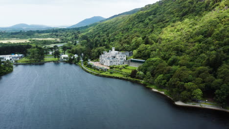 high angle aerial view over kylemore abbey and surrounding landscape