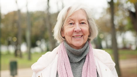 happy, senior woman and portrait in the park