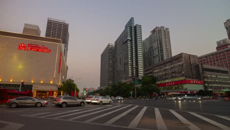 sunset evening illuminated changsha city traffic street crossroad panorama timelapse 4k china